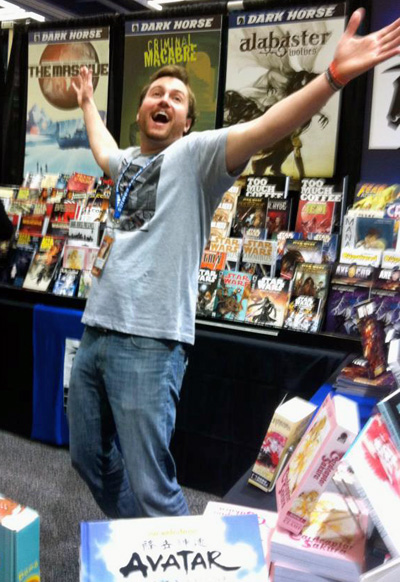 A bunch of books and me at Emerald City Comicon.